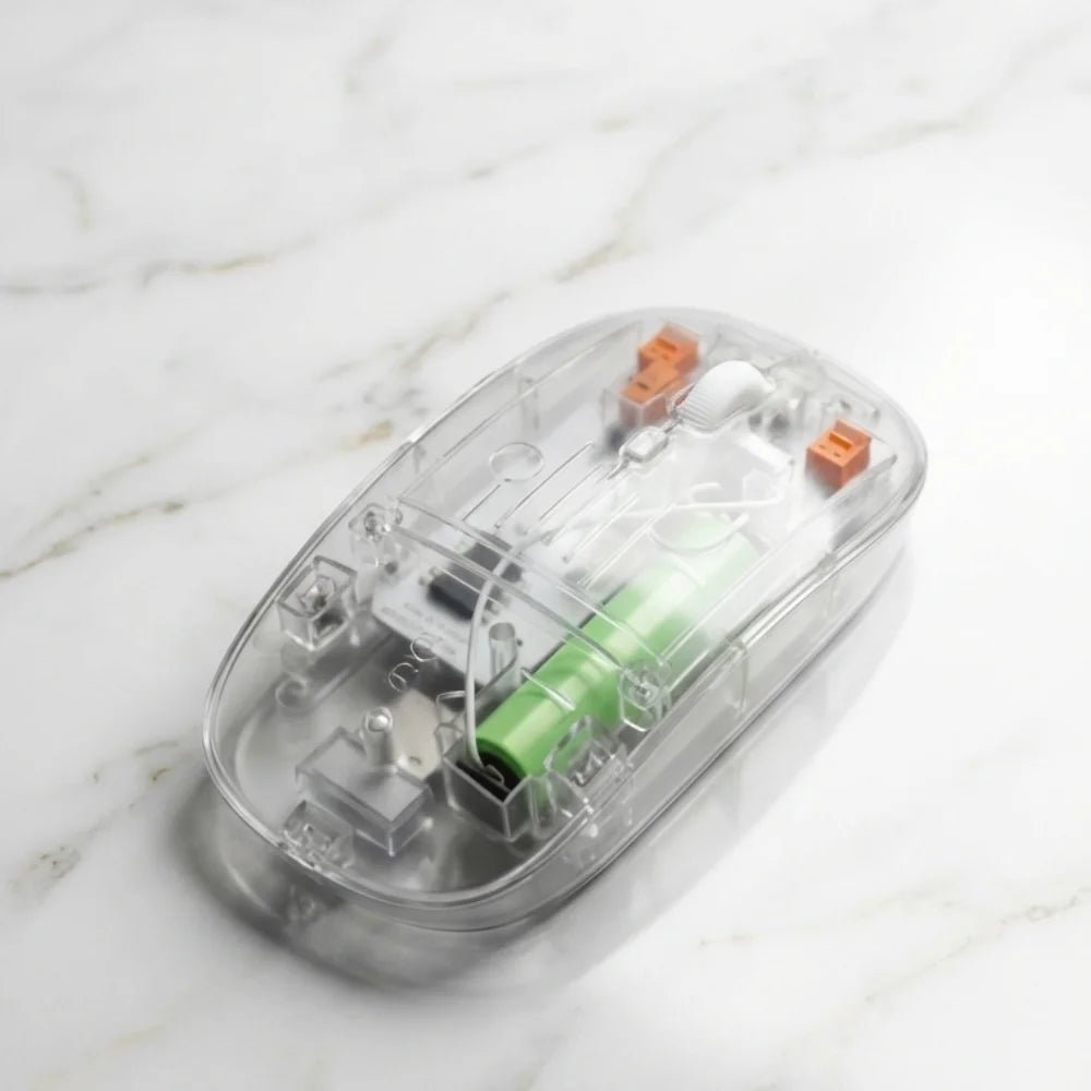 Clear electronic device with green battery on a marble surface
