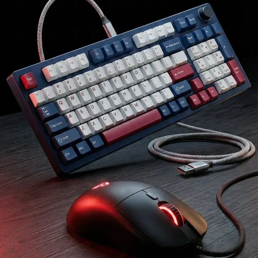 Mechanical keyboard and mouse set on a dark surface