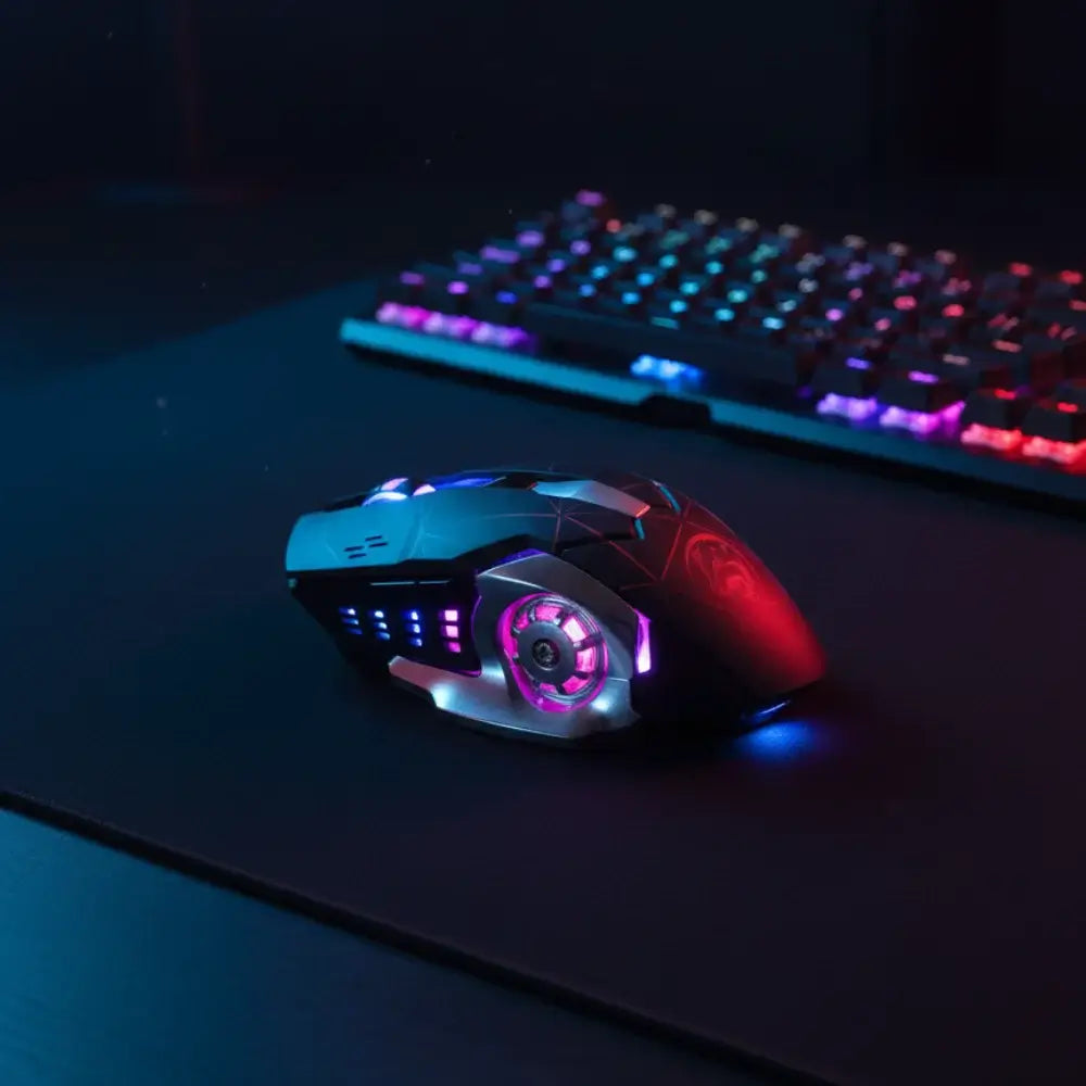Gaming mouse and keyboard with RGB lighting on a dark surface